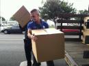 President, NC Rotary Club Unloading Supplies